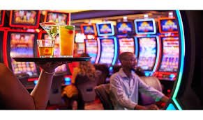 Mobile phone displaying login wetogel app with live-dealer blackjack table and account balance
